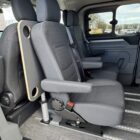 Folding camping table for the airline rail, located between the first and second rows of seats